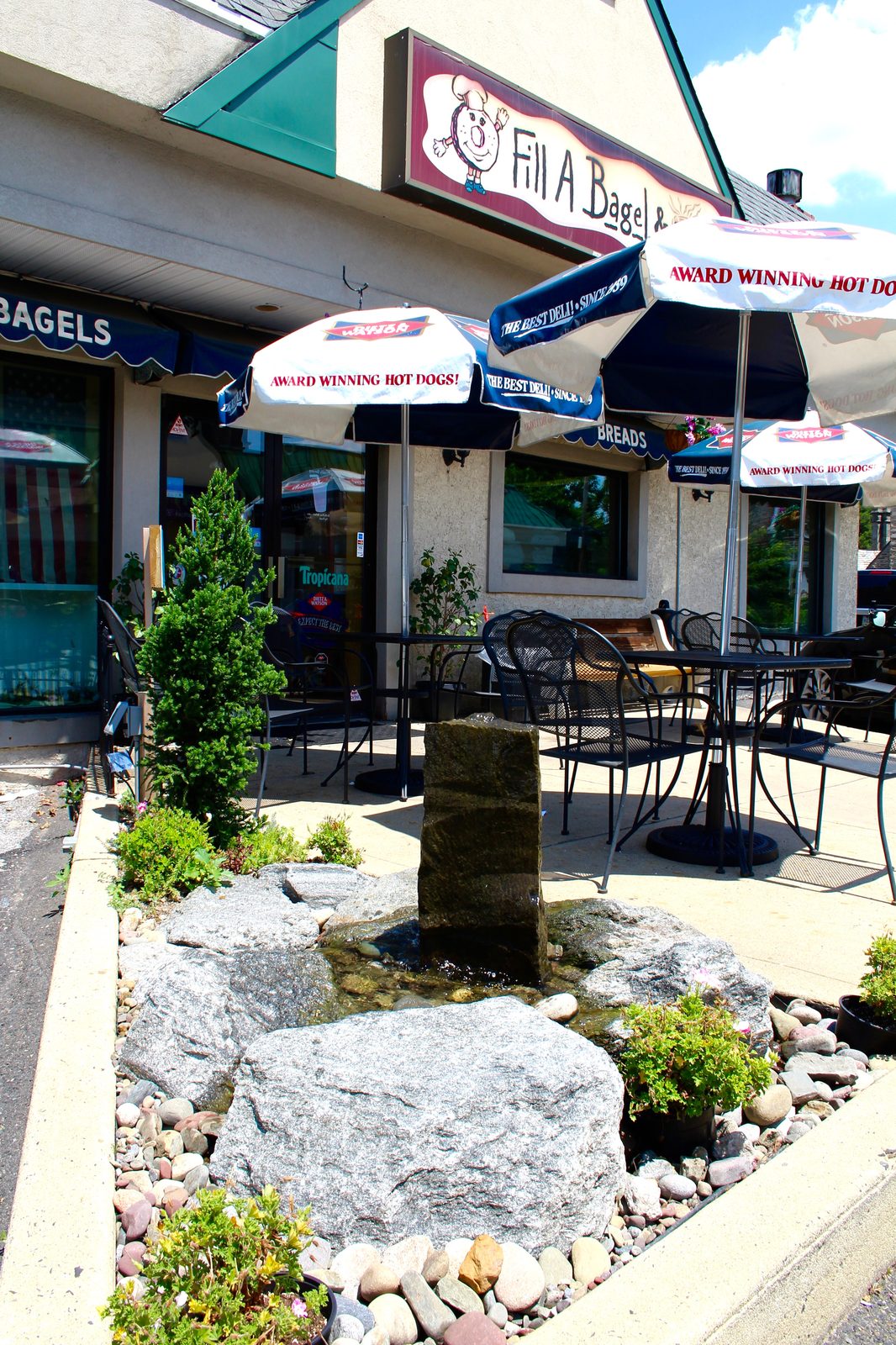 Basalt column fountain on a cafe patio at a Philadelphia storefront by AquaReale