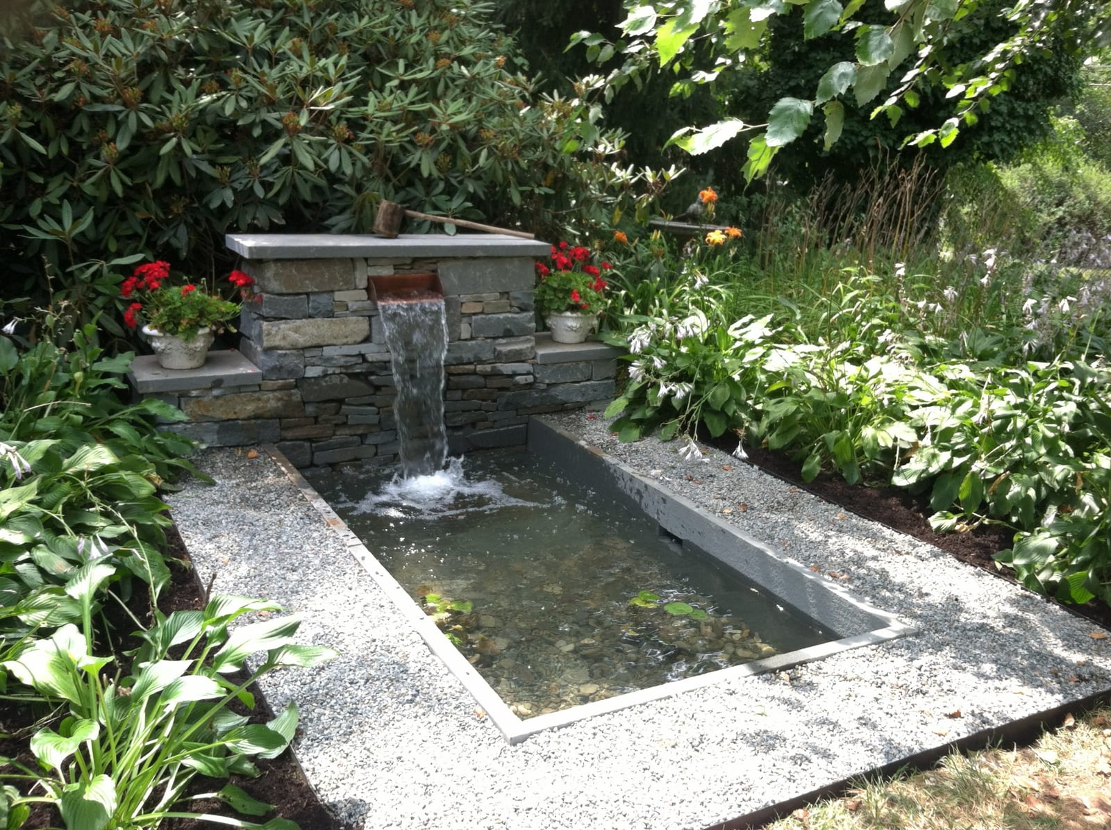 Elegant formal pond with waterfall