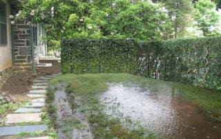 Backyard flooded after heavy rainstorm